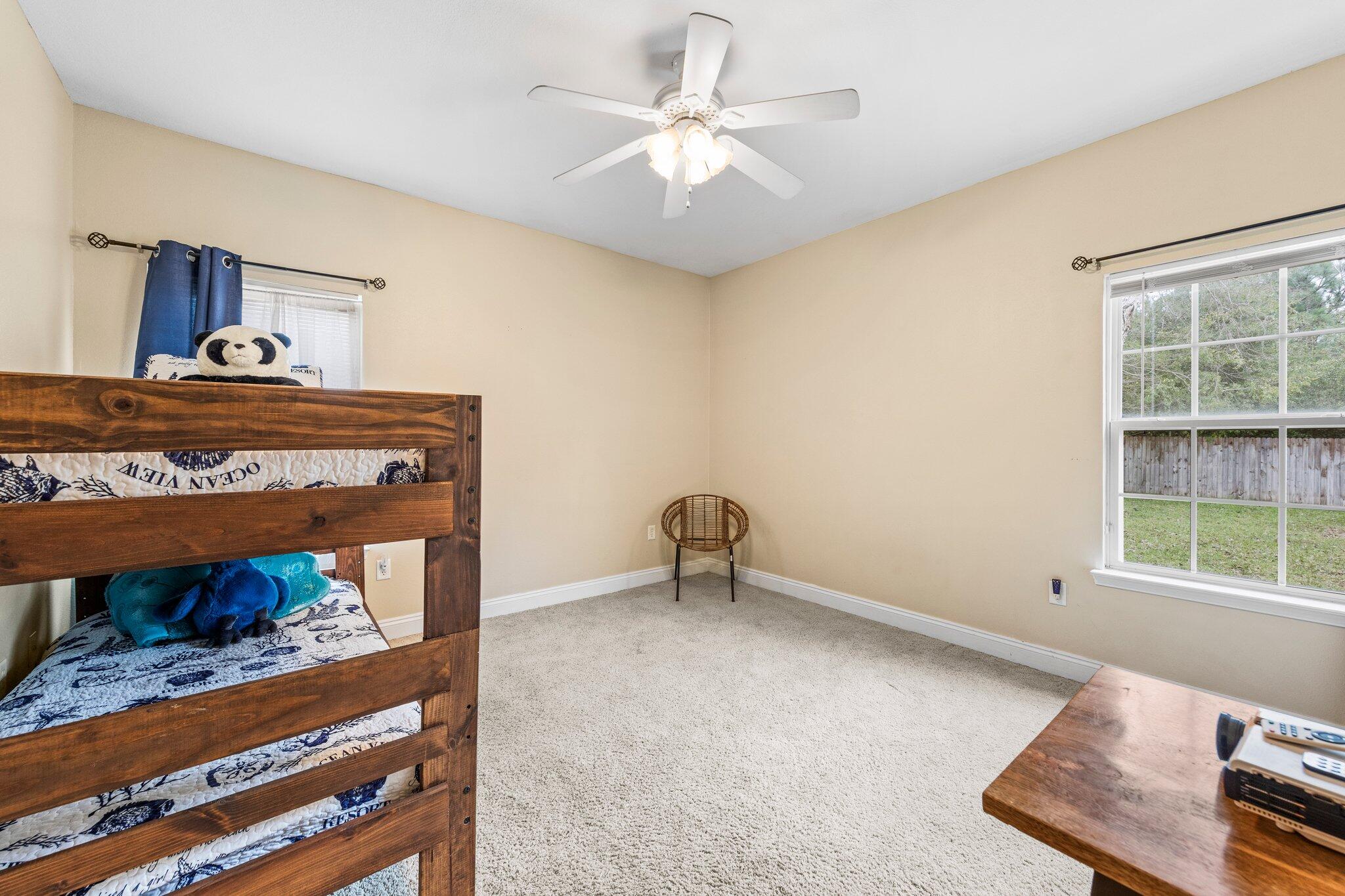 901 Shoal River Drive Crestview, FL 32539 - Photo 29 of 56 a view of room with window and ceiling fan