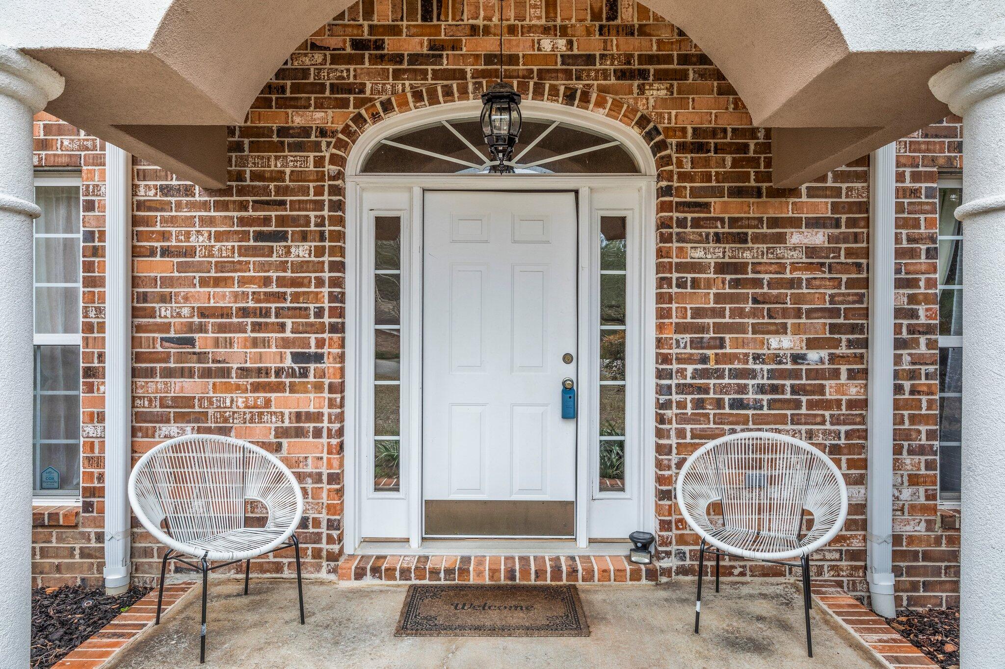 901 Shoal River Drive Crestview, FL 32539 - Photo 3 of 56 a front view of a house with chairs