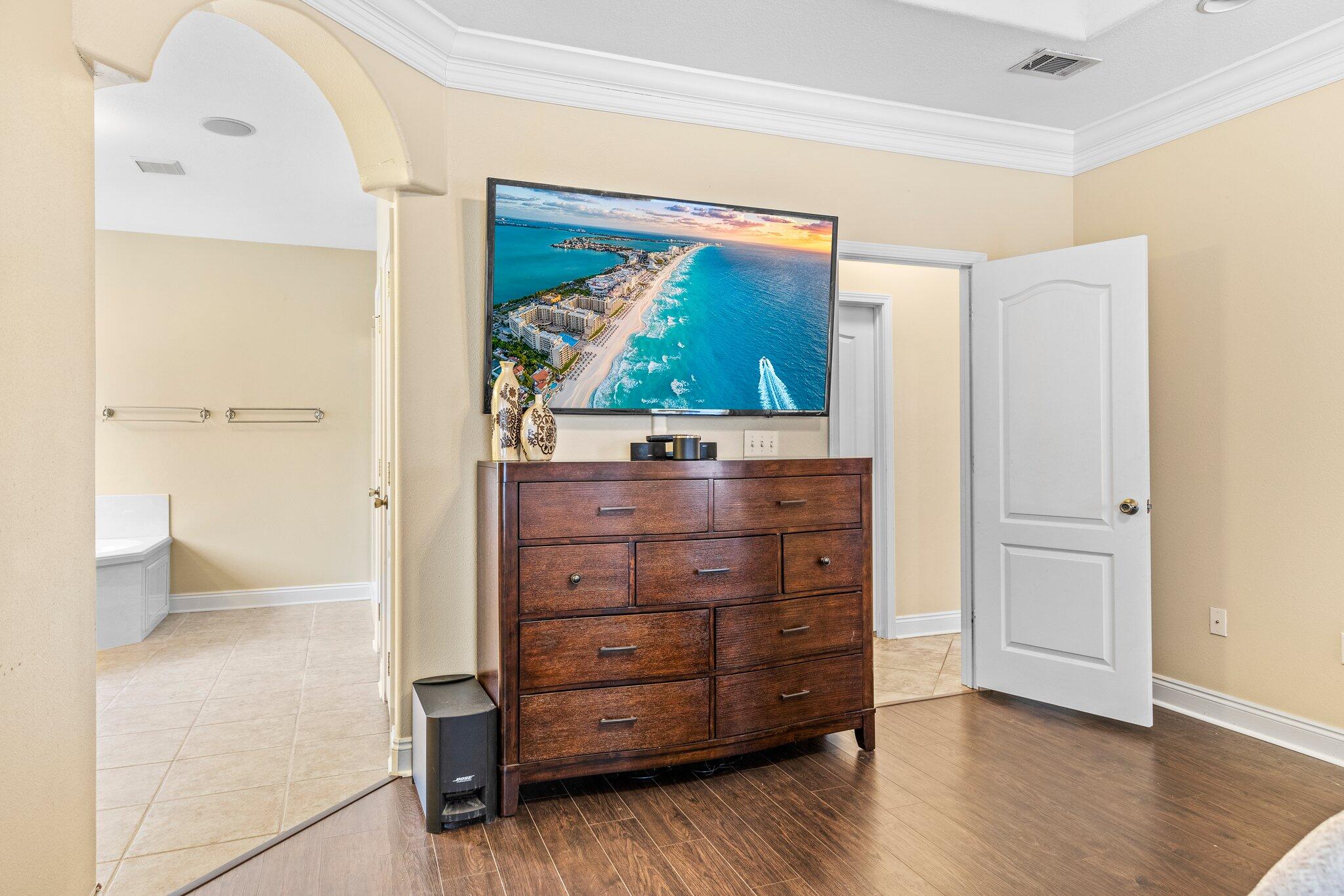 901 Shoal River Drive Crestview, FL 32539 - Photo 34 of 56 a view of a dresser with wooden floor