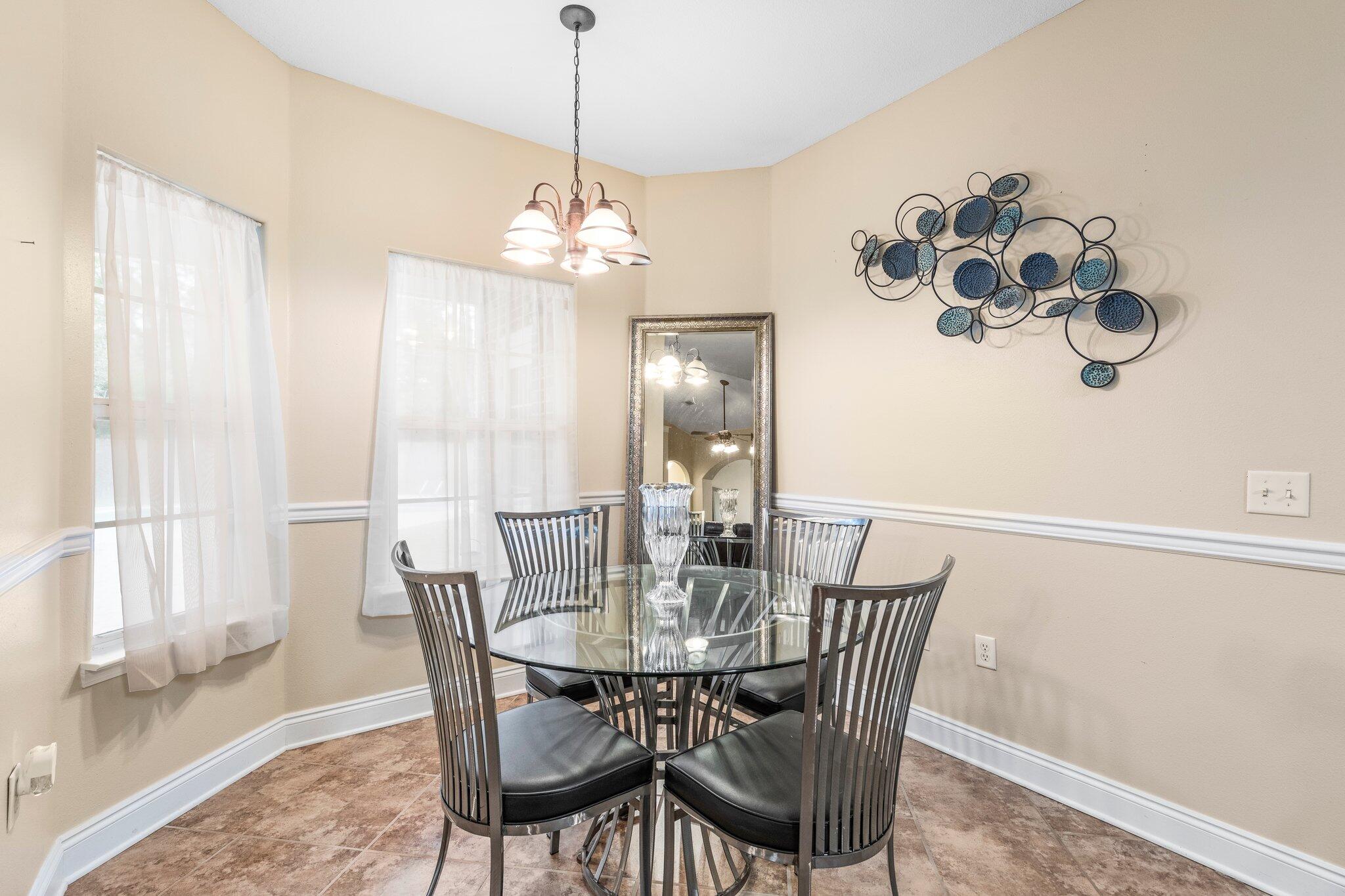 901 Shoal River Drive Crestview, FL 32539 - Photo 43 of 56 a view of a dining room with furniture window and outside view