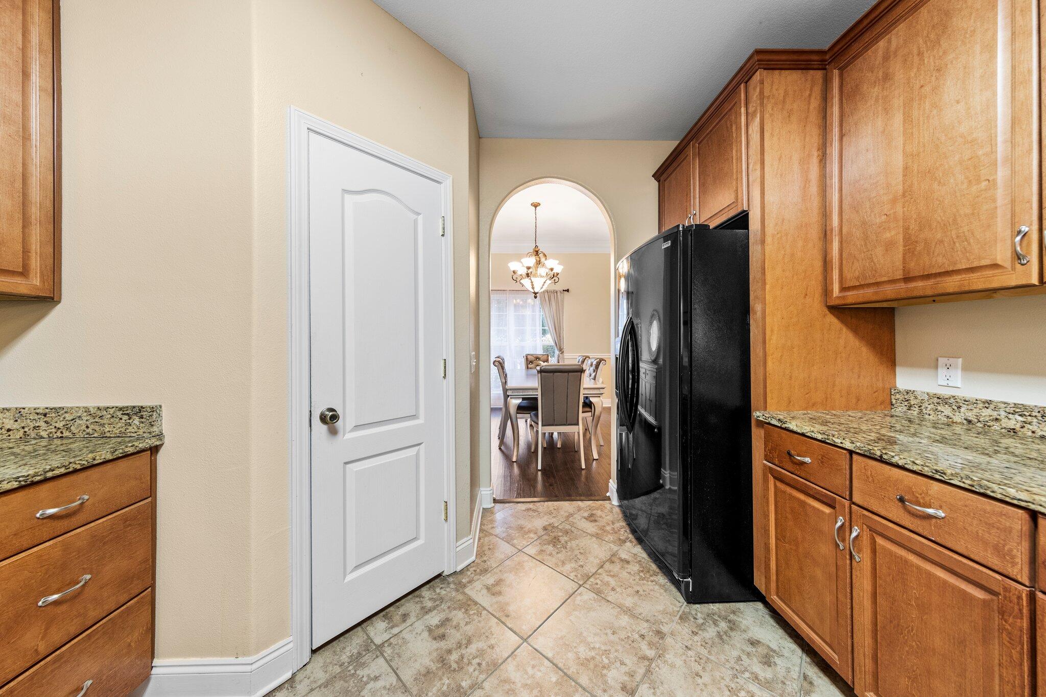 901 Shoal River Drive Crestview, FL 32539 - Photo 47 of 56 a kitchen with stainless steel appliances granite countertop a refrigerator and a sink