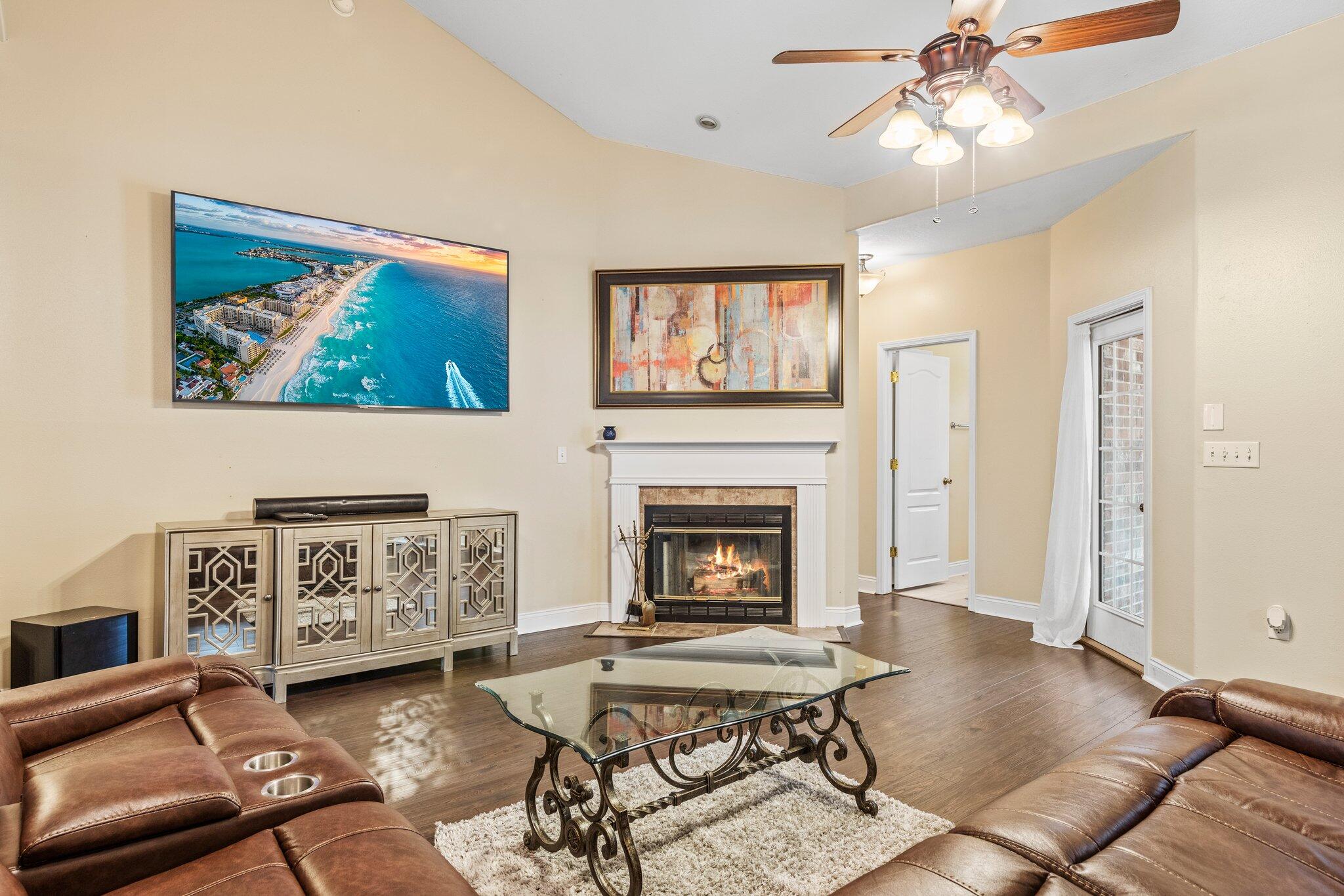 901 Shoal River Drive Crestview, FL 32539 - Photo 51 of 56 a living room with furniture and a fireplace