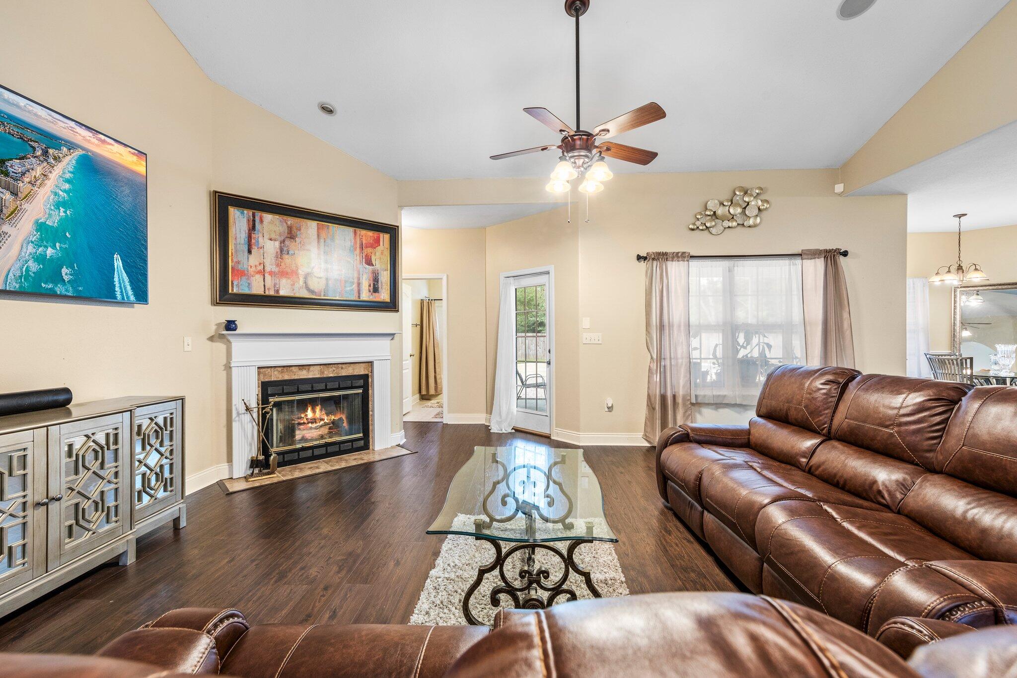 901 Shoal River Drive Crestview, FL 32539 - Photo 52 of 56 a living room with furniture and a fireplace