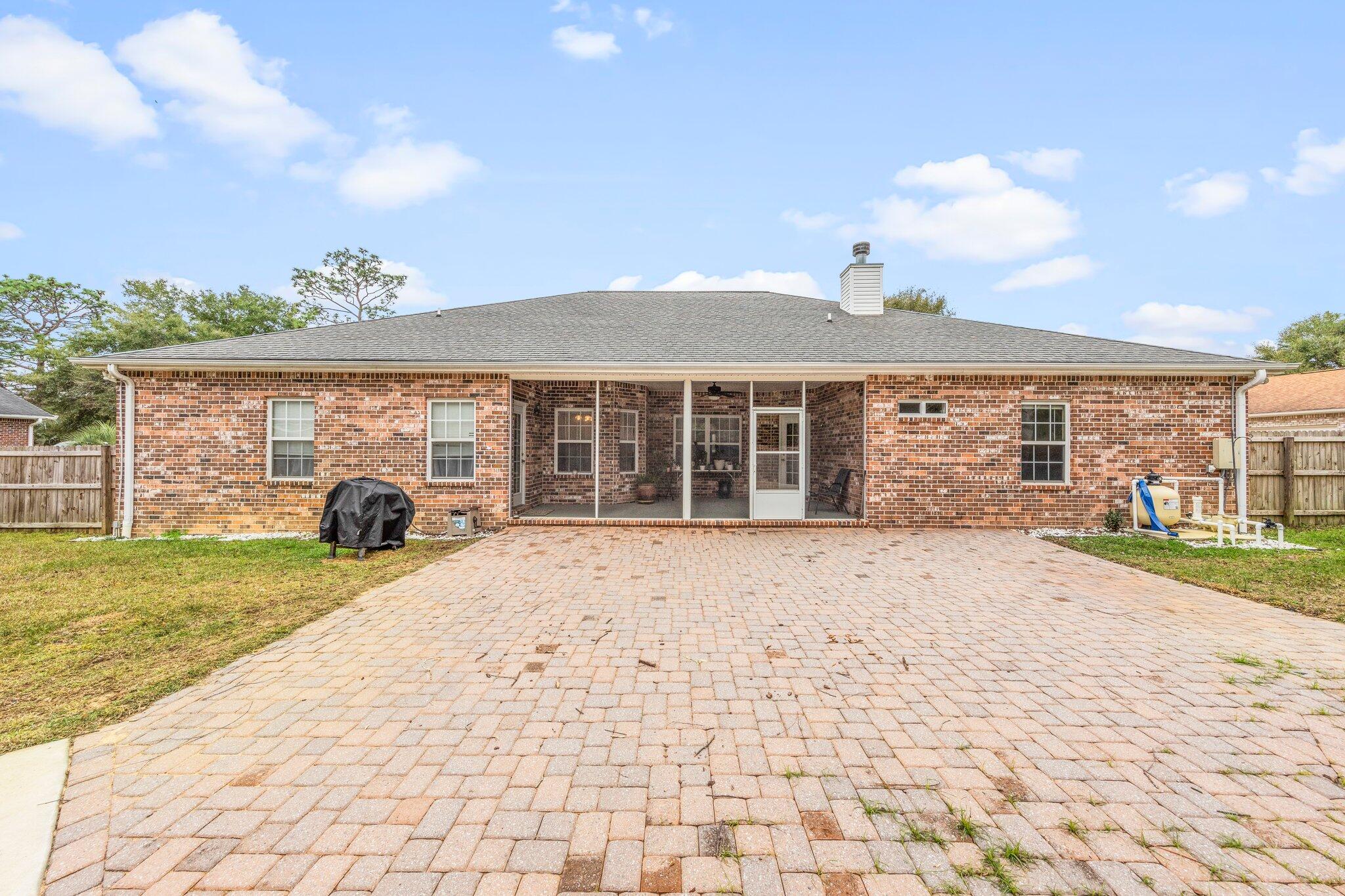 901 Shoal River Drive Crestview, FL 32539 - Photo 7 of 56 a front view of a house with a yard
