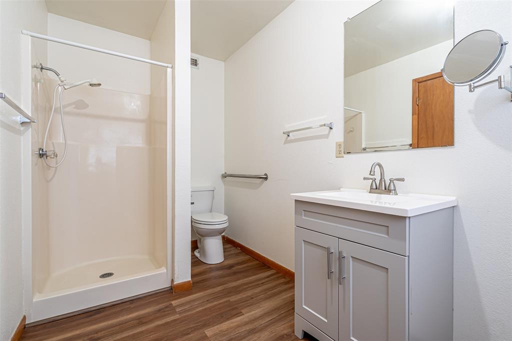 501 Endora Dublin, TX 76446 - Photo 32 of 39 a bathroom with a sink a toilet and shower