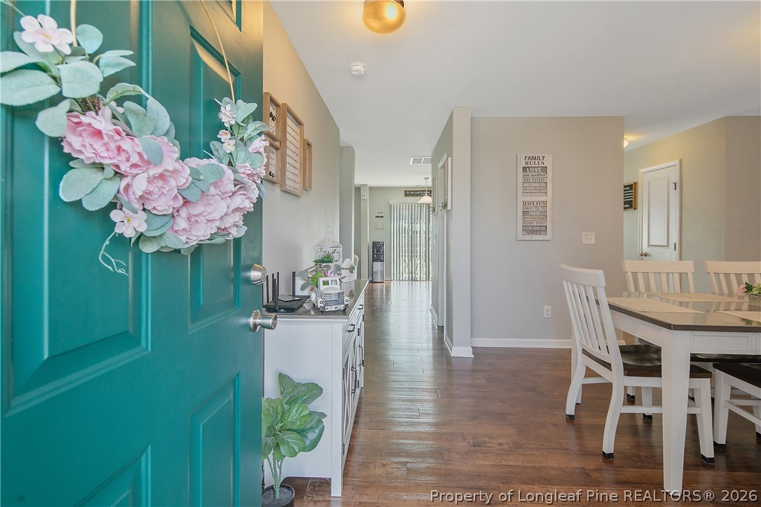 340 Battery Way Bunnlevel, NC 28323 - Photo 4 of 50 a dining room with furniture and chandelier