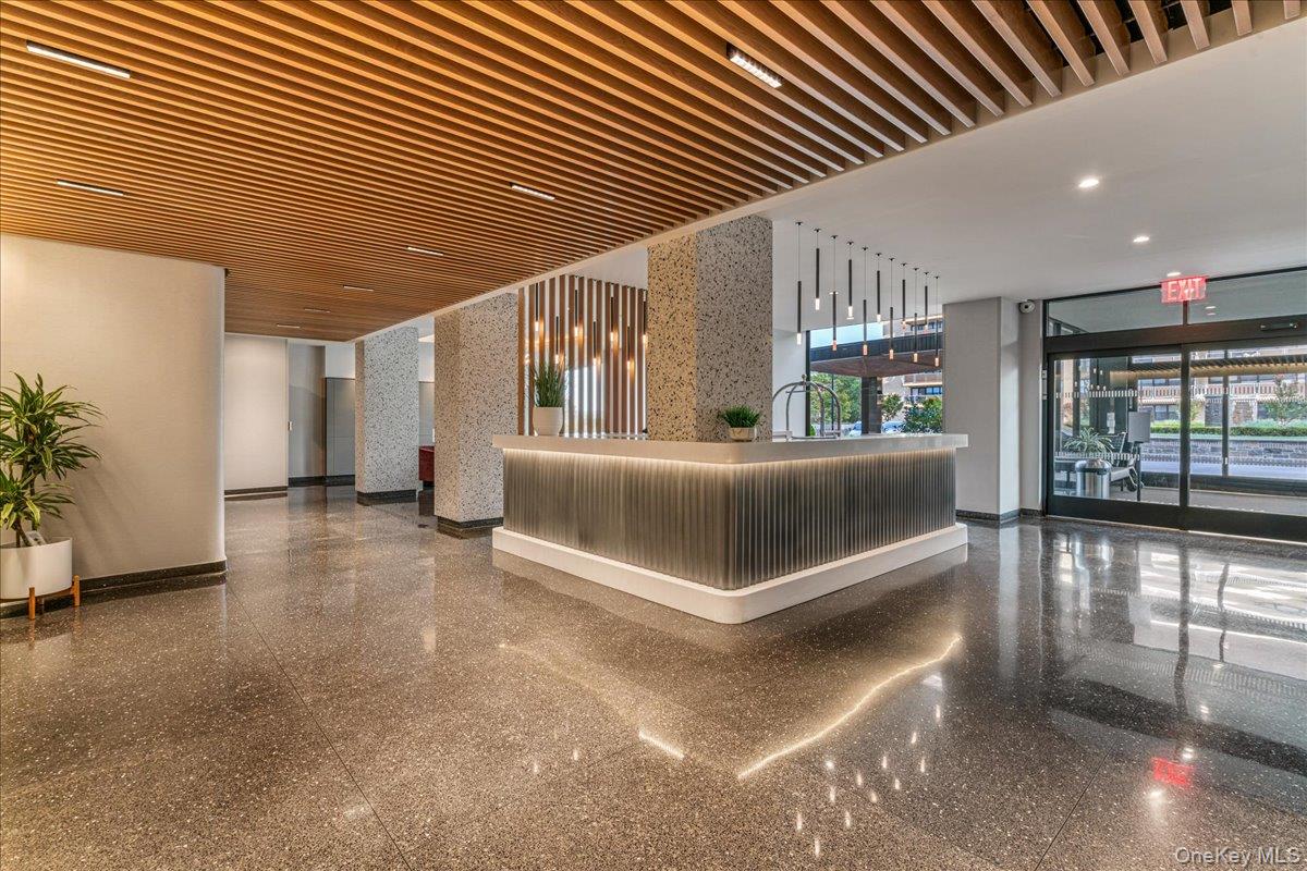 17-85 215th Street, Unit 9L Queens, NY 11360 - Photo 18 of 35 a bedroom with furniture and large window