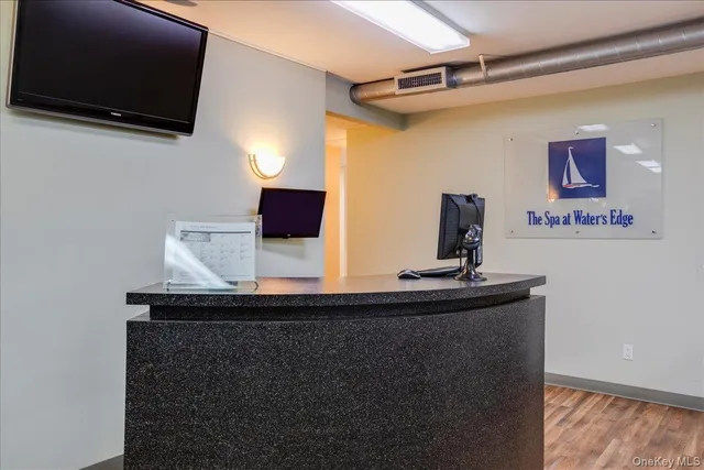 a view of a entryway with dining room and wooden floor
