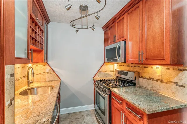 a kitchen with a stove and a sink