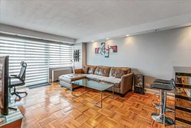 a living room with furniture and a window