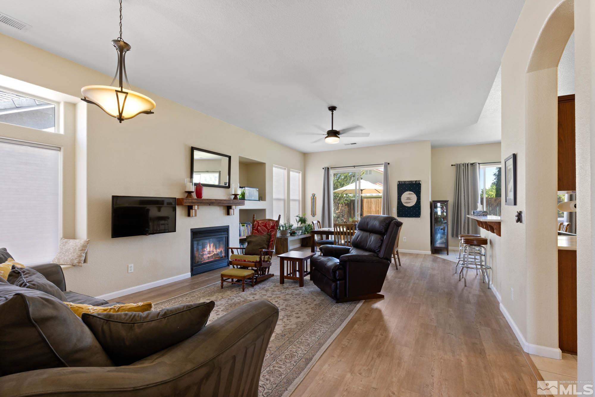 1865 Montelena Court Reno, NV 89521 - Photo 18 of 34 a living room with furniture and a flat screen tv