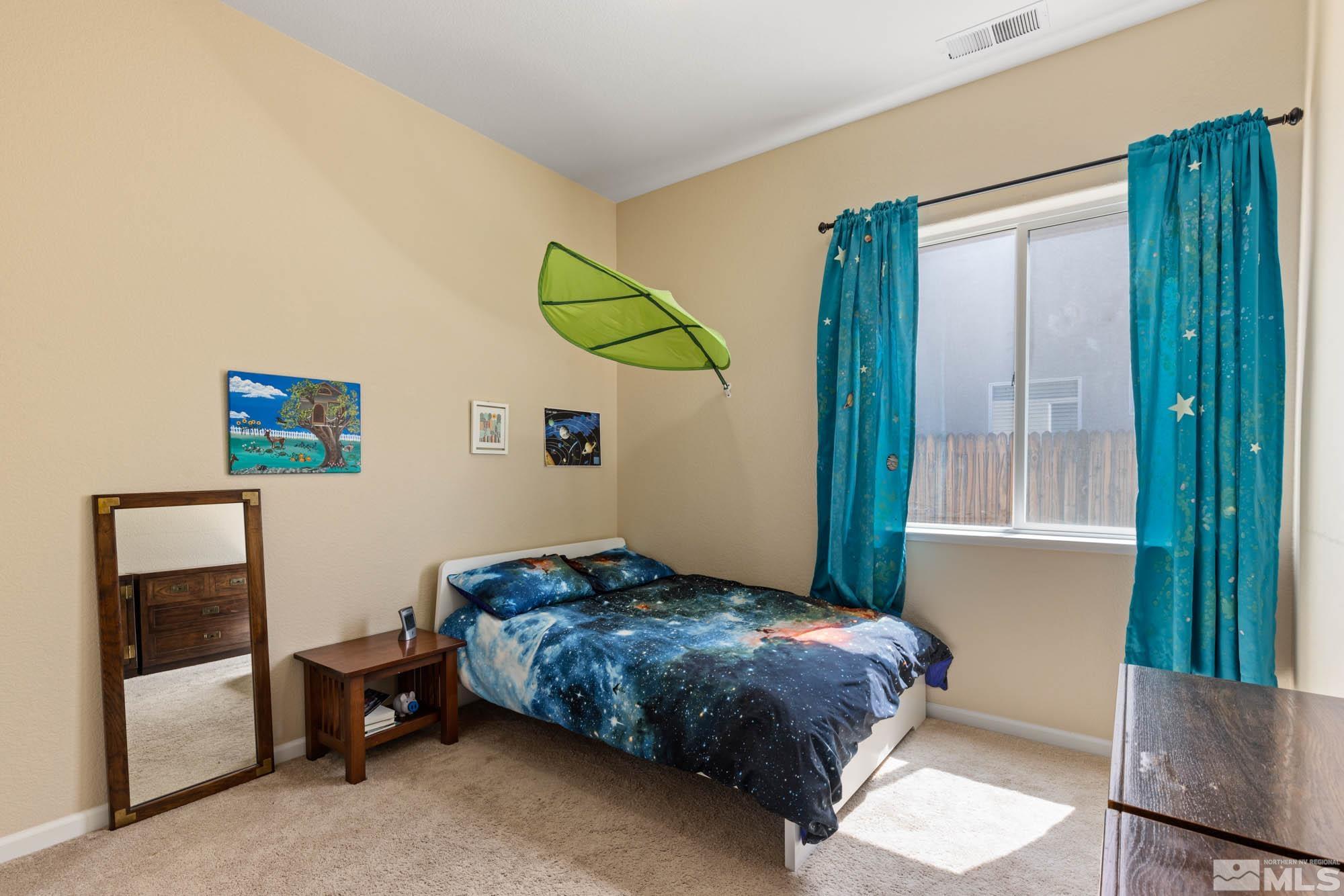1865 Montelena Court Reno, NV 89521 - Photo 29 of 34 a bedroom with a bed and a window