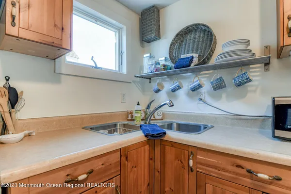 a kitchen with a sink and cabinets
