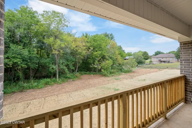 a balcony with an outdoor space