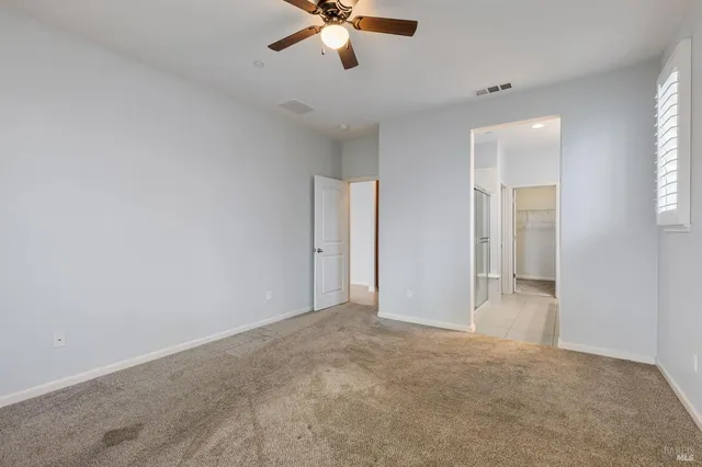 a bathroom with a shower sink and mirror