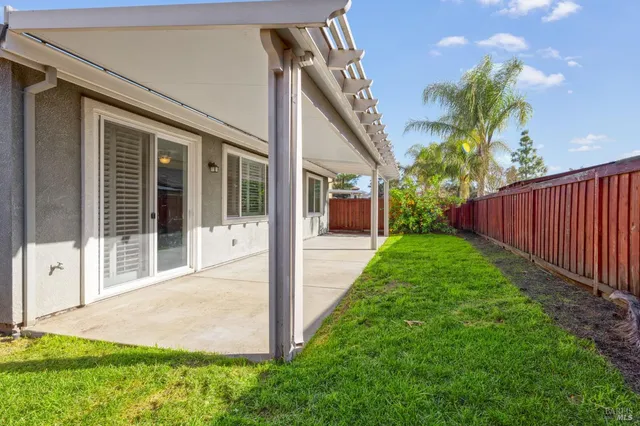 a house view with a backyard space