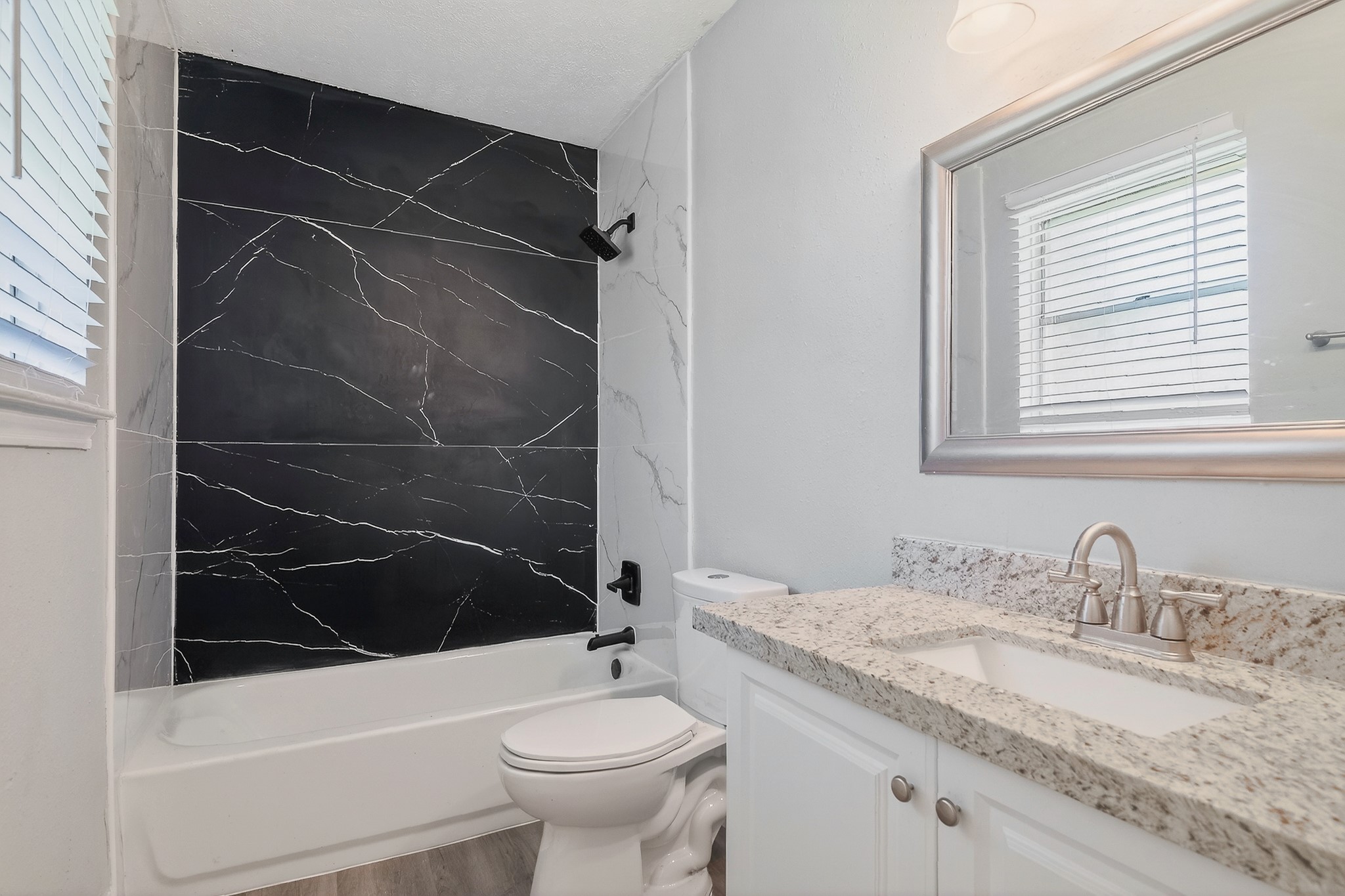 2510 Marble Falls Drive Spring, TX 77373 - Photo 15 of 26 a bathroom with a granite countertop sink toilet and shower