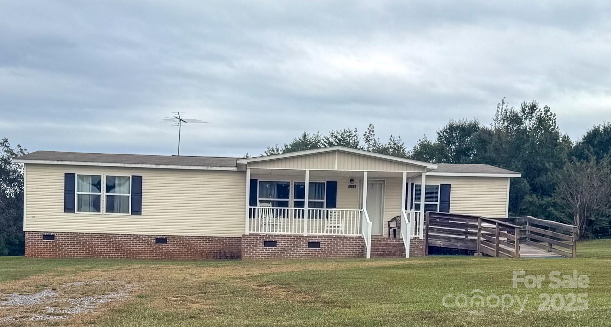 4559 Union Highway Gaffney, SC 29340 - Photo 1 of 23 a front view of a house with a garden and yard