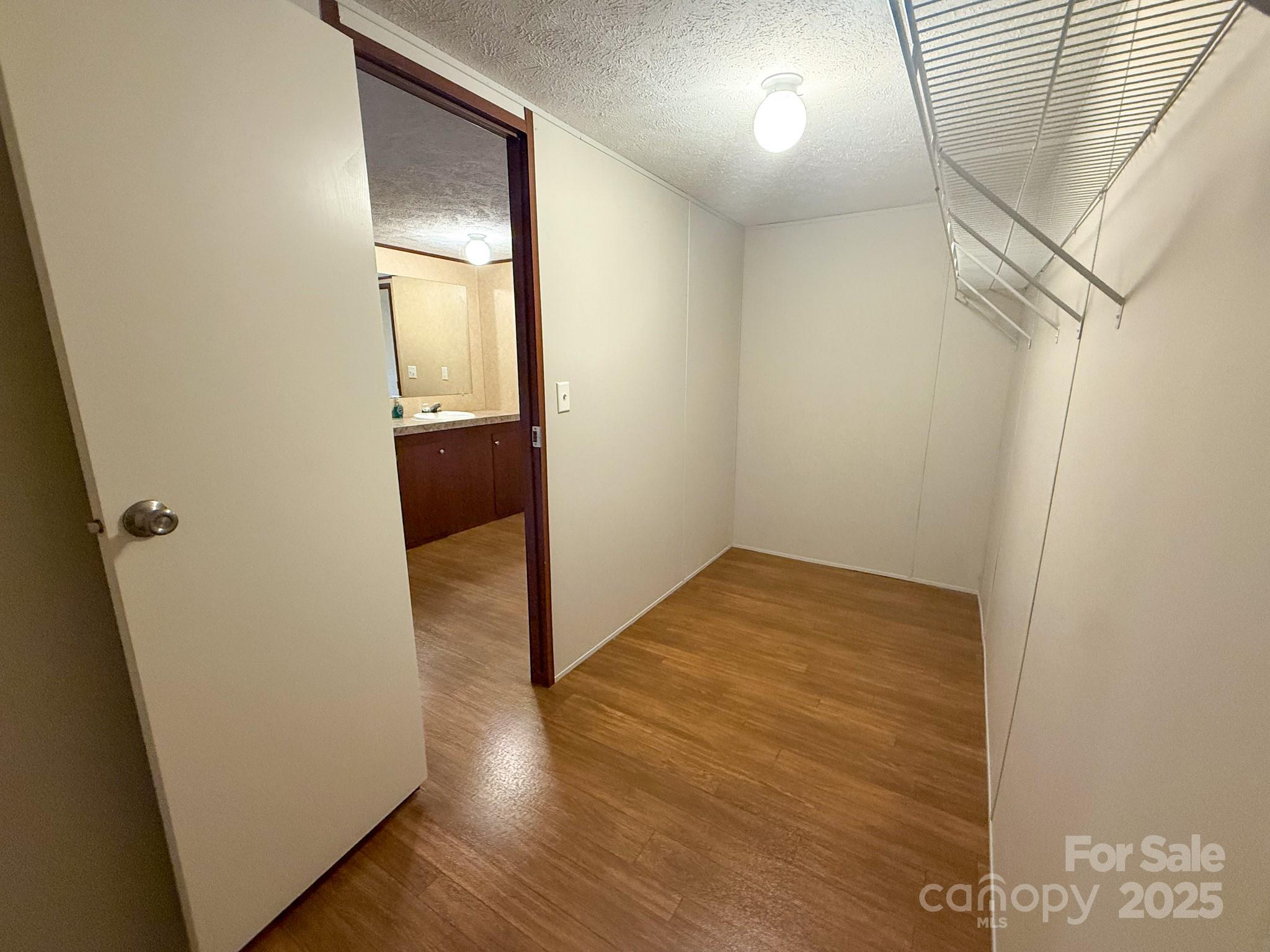 4559 Union Highway Gaffney, SC 29340 - Photo 16 of 23 an empty room with wooden floor and windows