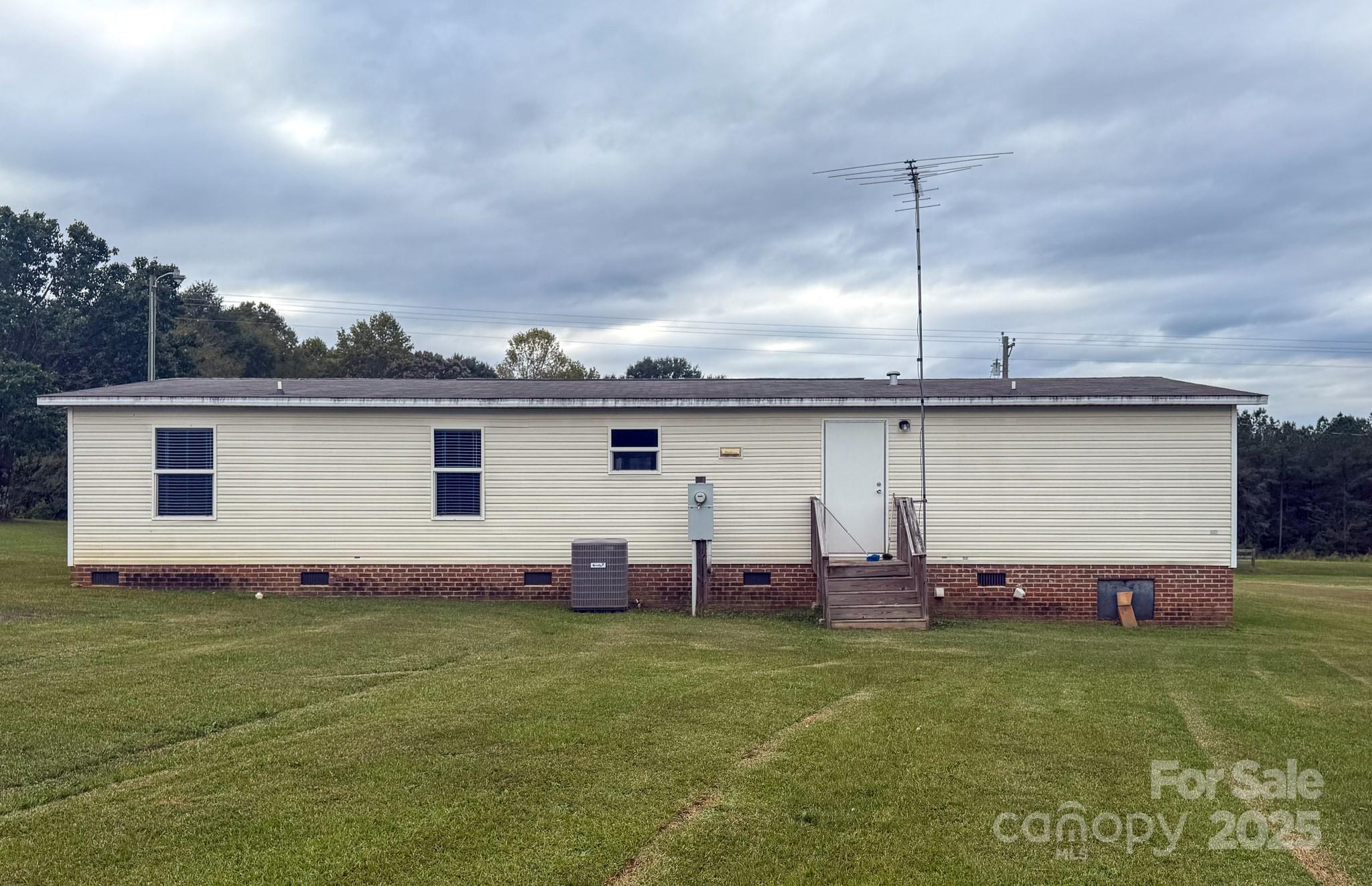 4559 Union Highway Gaffney, SC 29340 - Photo 21 of 23 a view of a backyard with couches under an umbrella