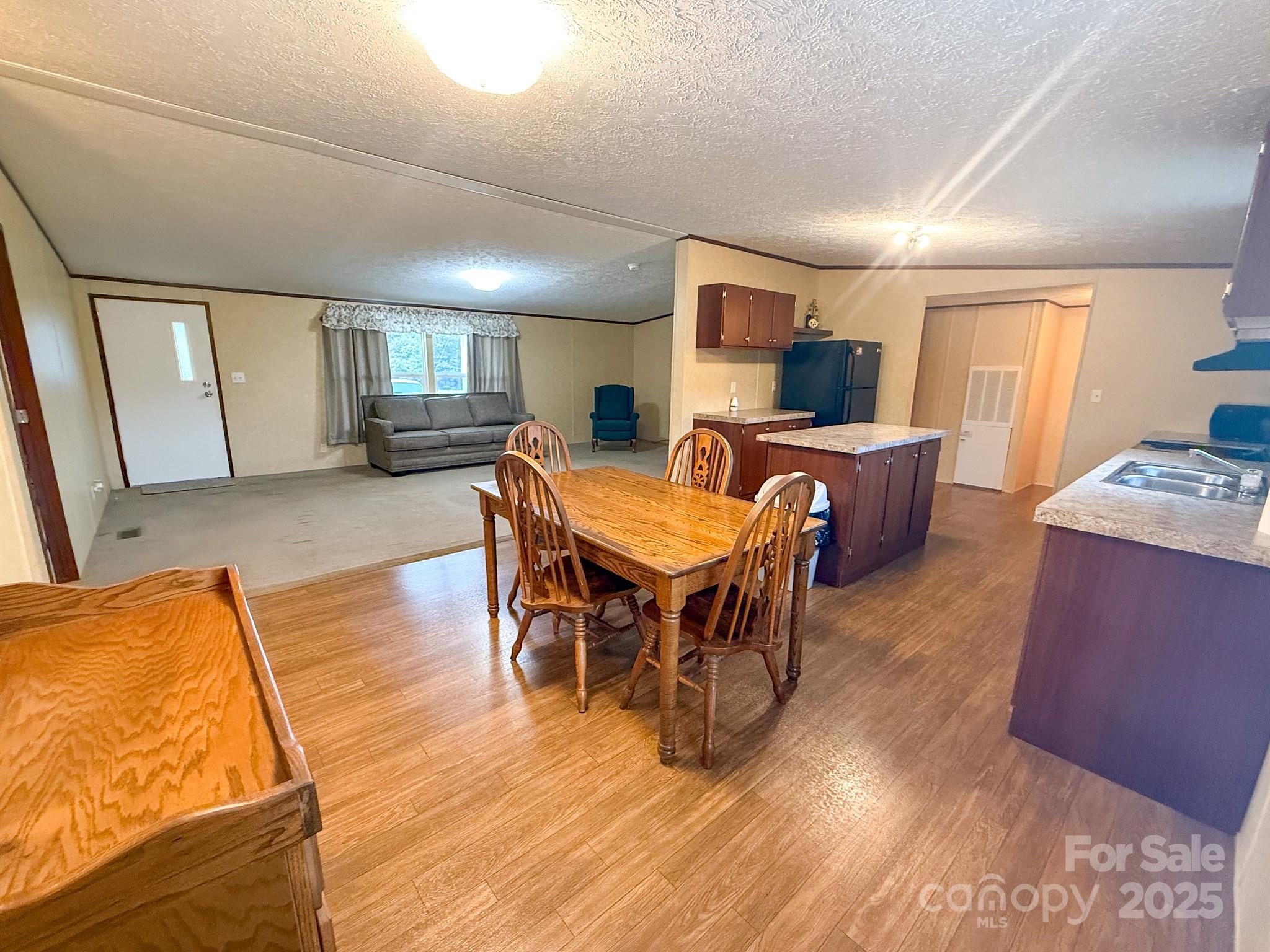 4559 Union Highway Gaffney, SC 29340 - Photo 10 of 23 a view of a dining room with furniture window and wooden floor