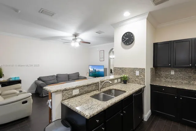 a kitchen with a stove and a sink
