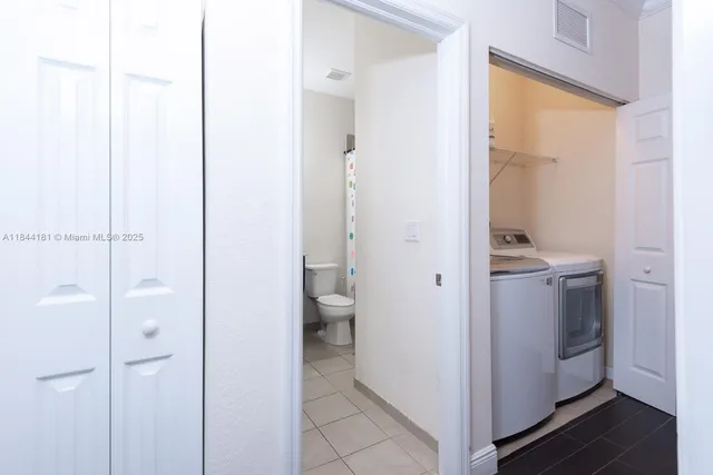 a bathroom with a granite countertop sink
