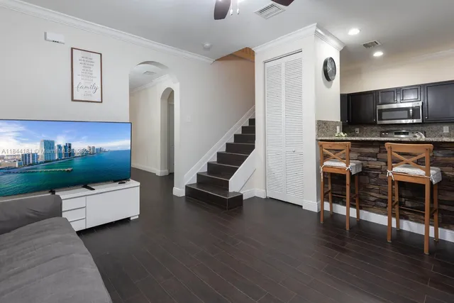 a view of kitchen with furniture and wooden floor