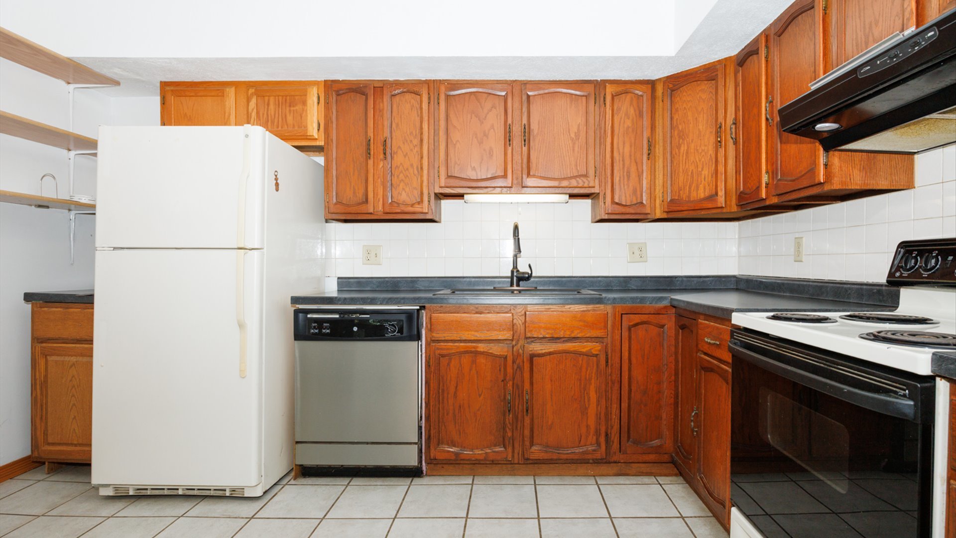 306 Judith Drive Normal, IL 61761 - Photo 14 of 40 a kitchen with stainless steel appliances granite countertop a refrigerator sink and cabinets