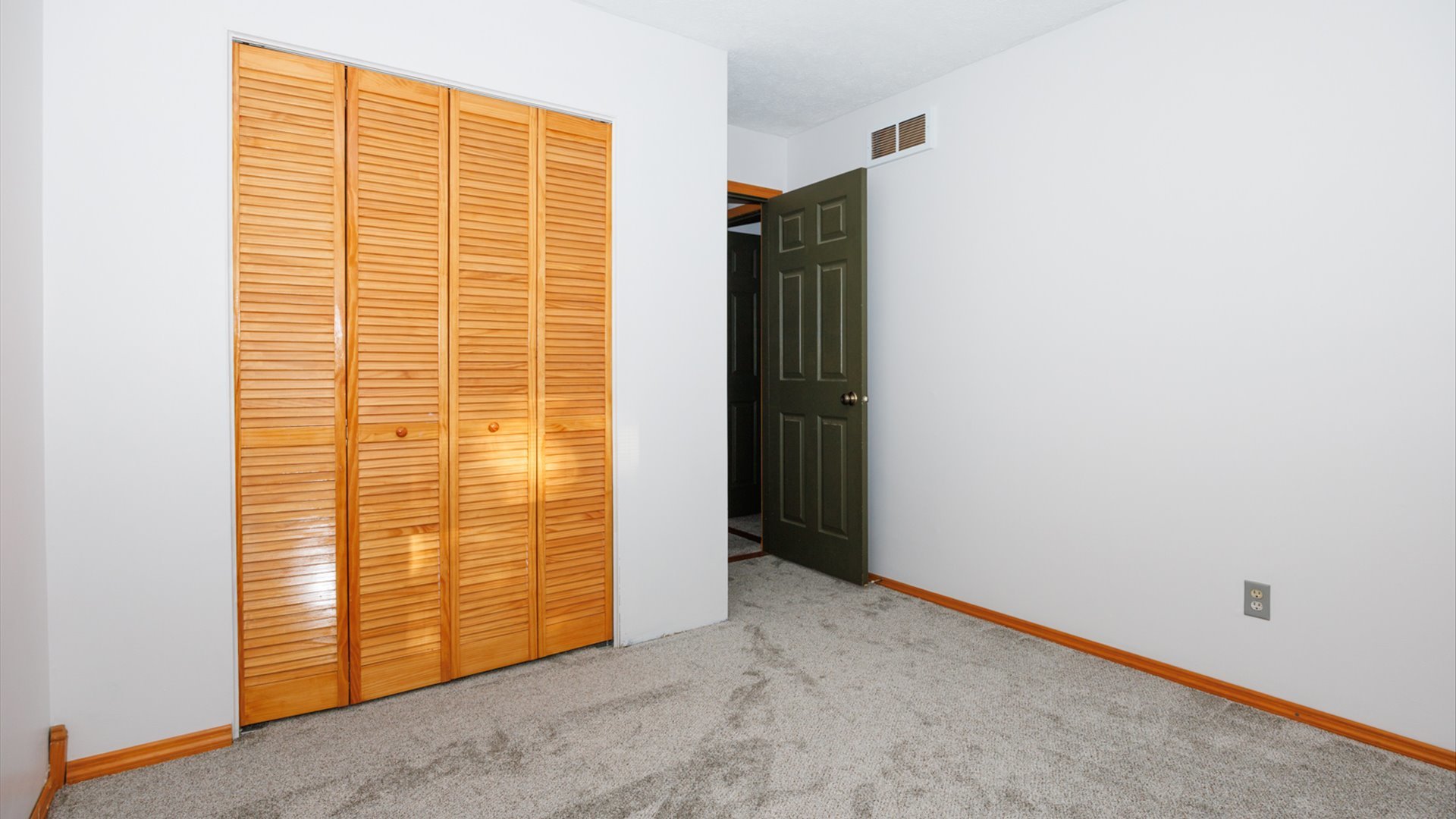 306 Judith Drive Normal, IL 61761 - Photo 21 of 40 a view of an empty room with wooden floor