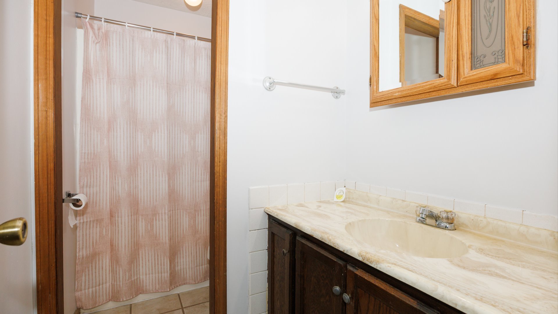 306 Judith Drive Normal, IL 61761 - Photo 22 of 40 a bathroom with a granite countertop sink and a mirror