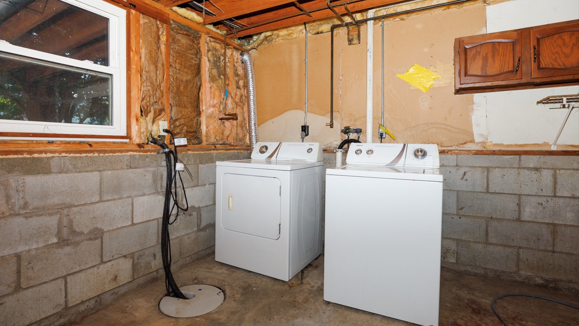 306 Judith Drive Normal, IL 61761 - Photo 32 of 40 a bathroom with a sink a window and a shower
