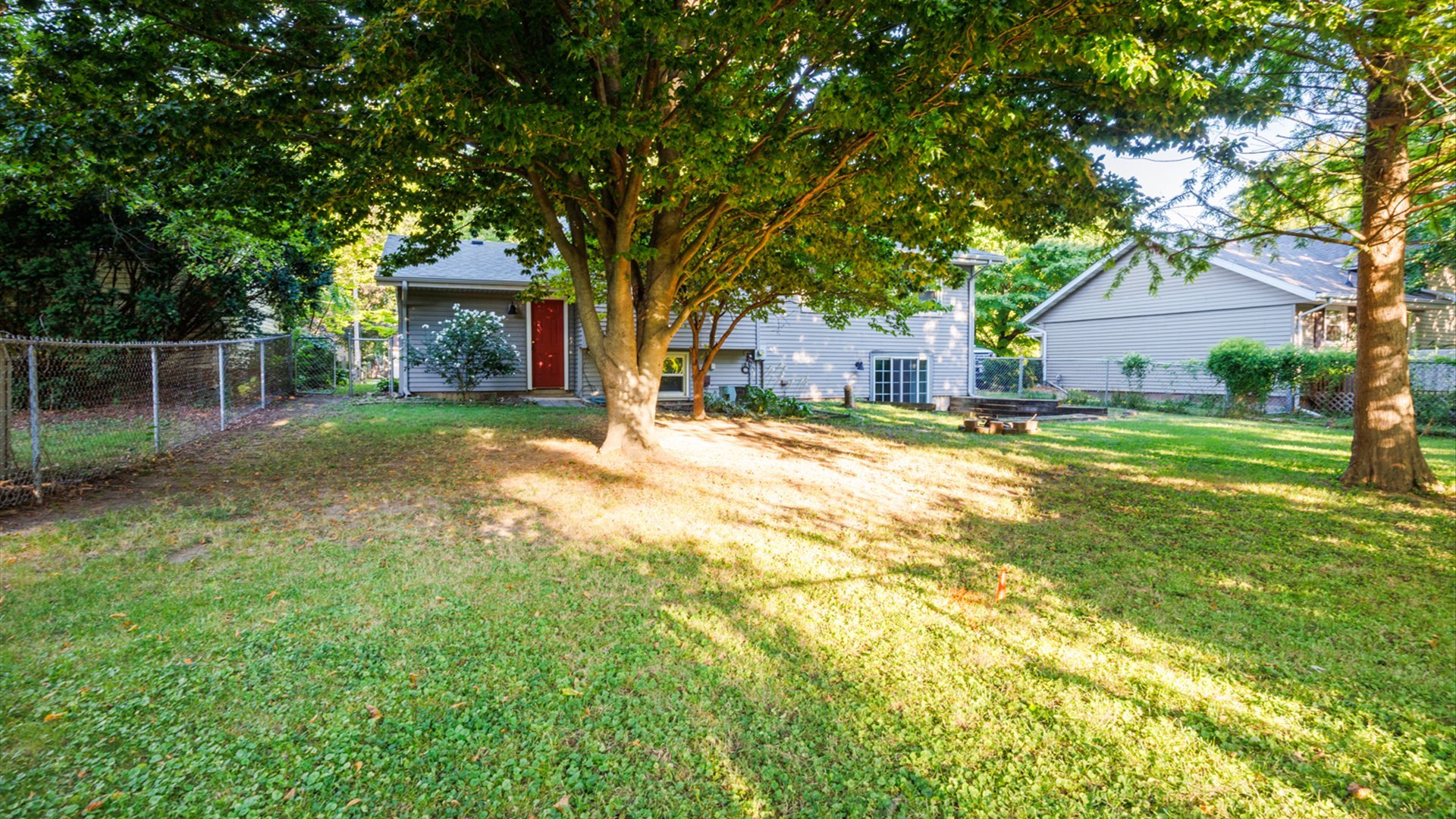 306 Judith Drive Normal, IL 61761 - Photo 35 of 40 a view of a house with a yard and tree s