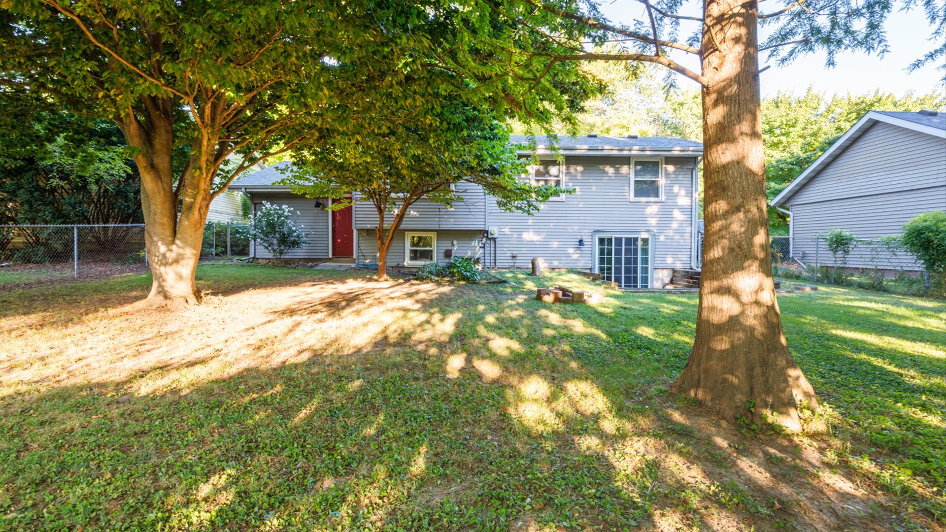 306 Judith Drive Normal, IL 61761 - Photo 36 of 40 a view of a yard in front of house with a large tree