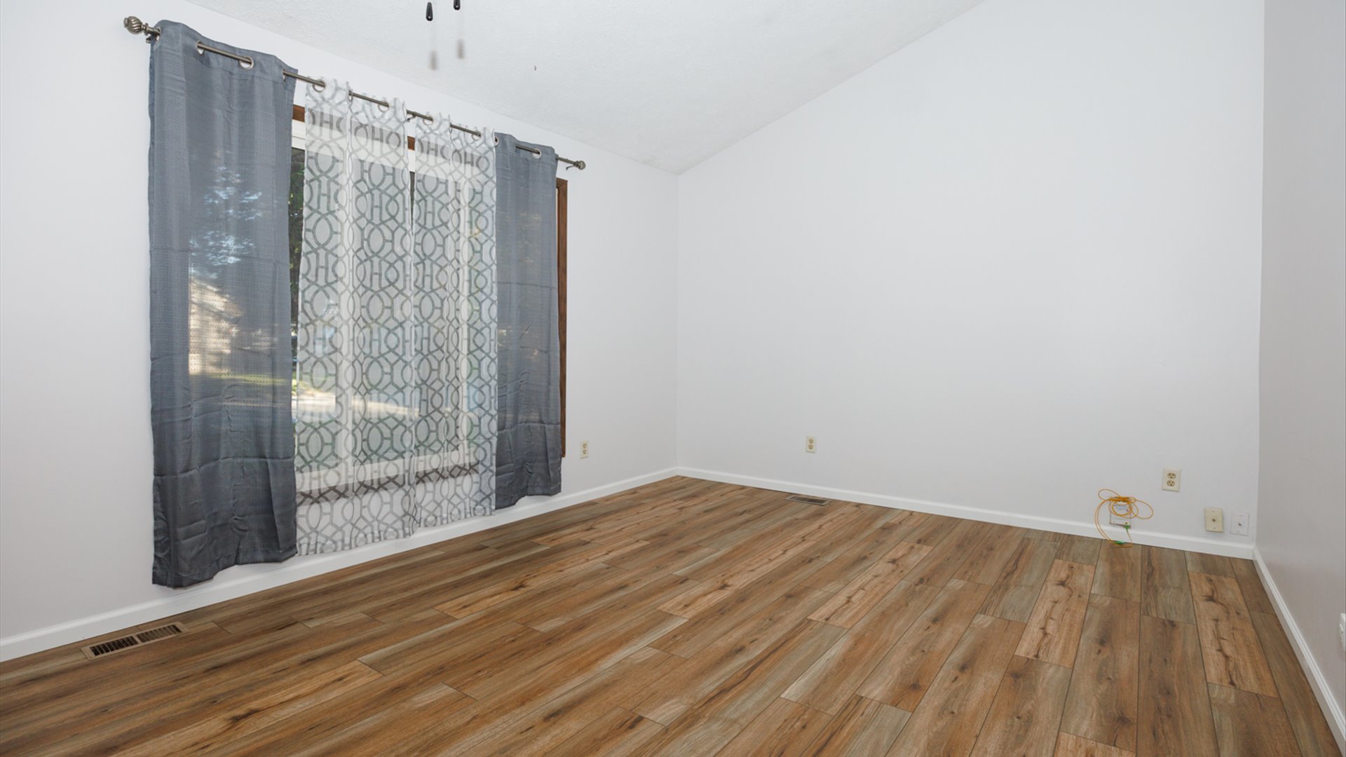 306 Judith Drive Normal, IL 61761 - Photo 7 of 40 a view of a room with wooden floor and white walls