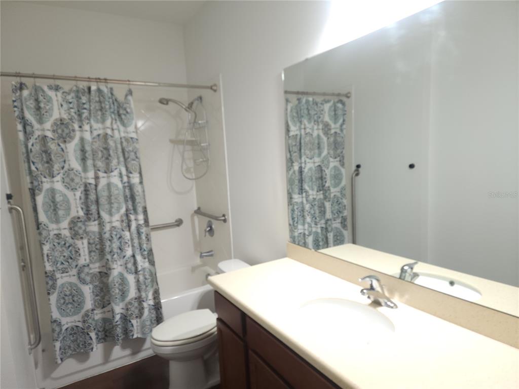 3230 Stratton Circle Kissimmee, FL 34744 - Photo 23 of 28 a bathroom with a sink toilet and shower