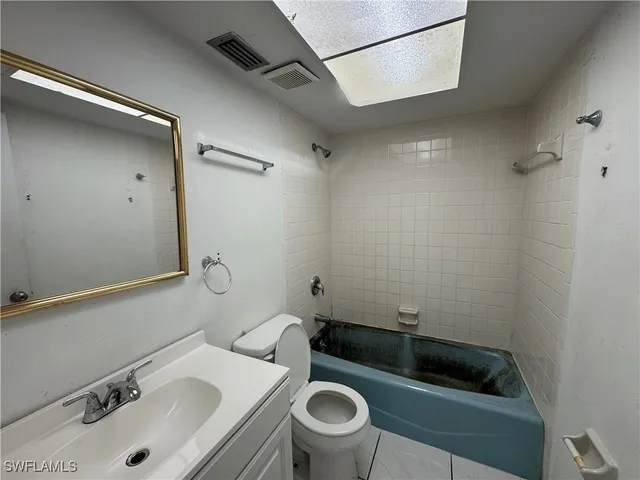a bathroom with a sink and a toilet
