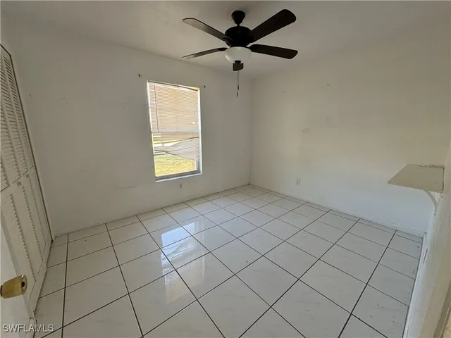 a view of an empty room and window