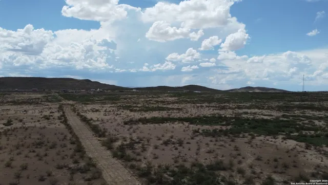 a view of mountain with sky