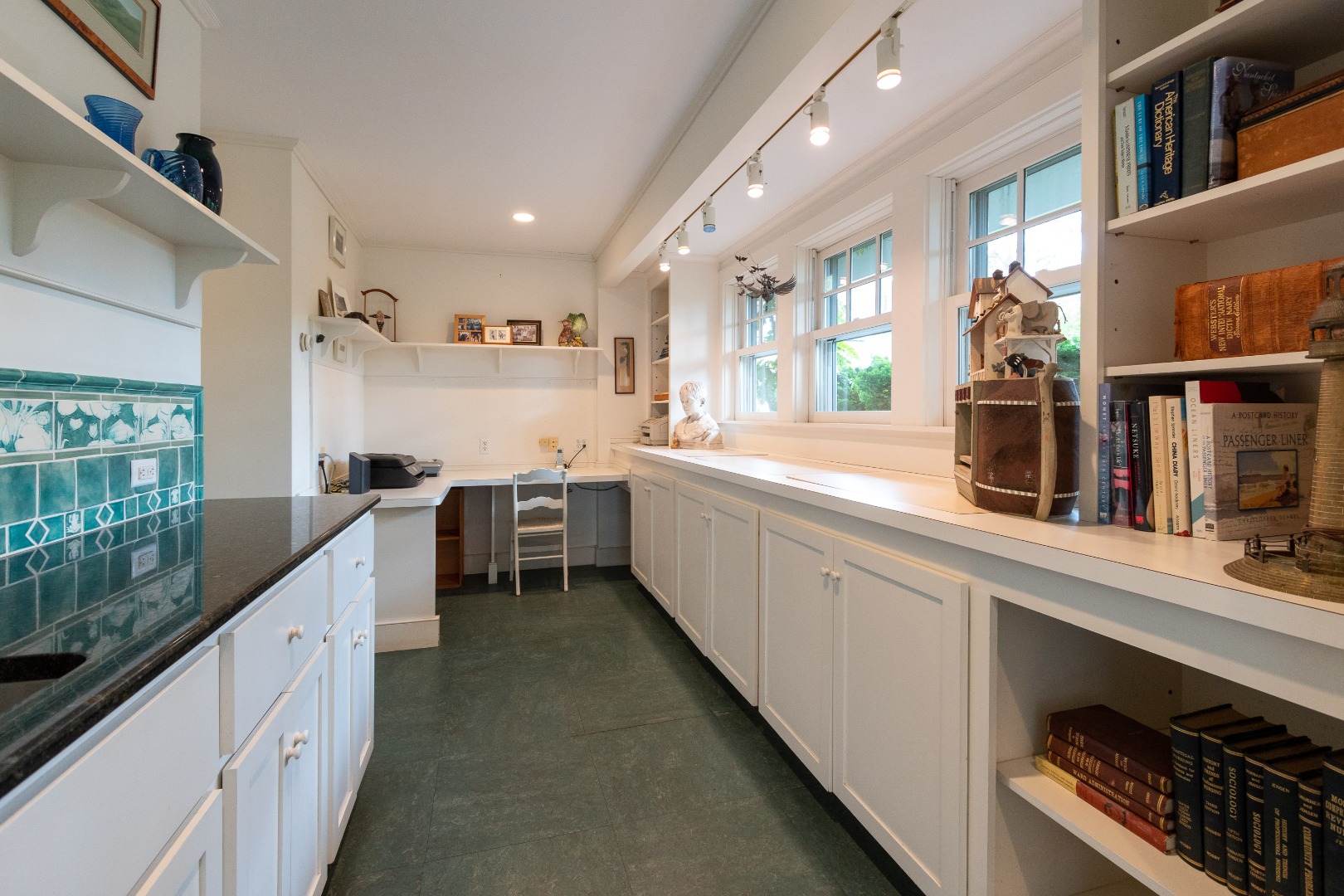 15 Cliff Road Nantucket, MA 02554 - Photo 22 of 50 a kitchen with counter top space and stainless steel appliances