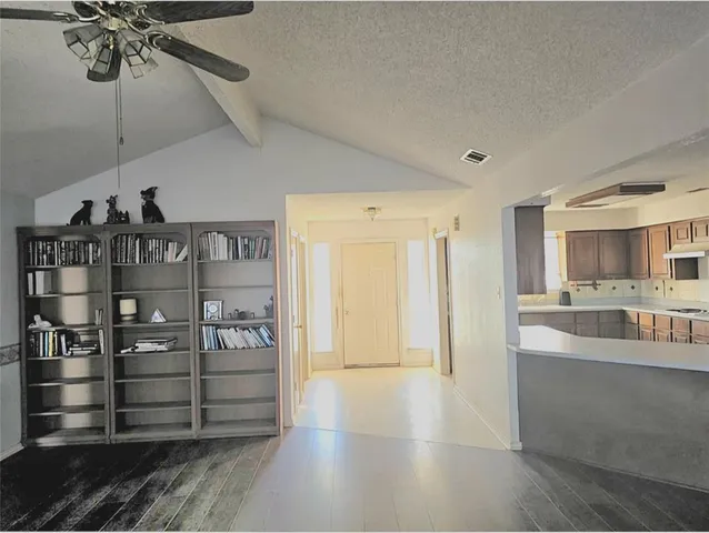 a view of a hallway with windows