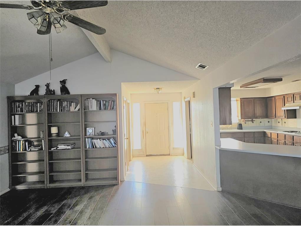 810 Cody Road Ennis, TX 75119 - Photo 18 of 31 a view of a livingroom with furniture and a ceiling fan