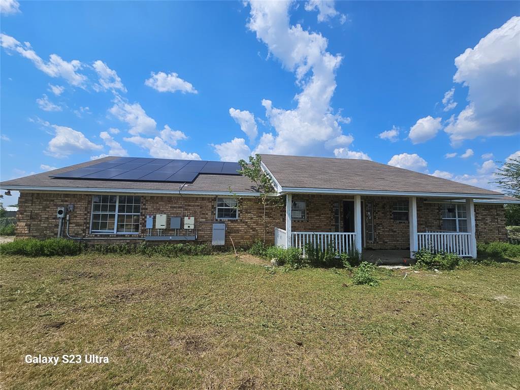 810 Cody Road Ennis, TX 75119 - Photo 2 of 31 a front view of a house with garden