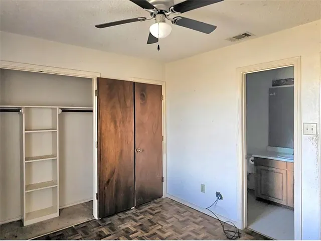 a bathroom with a shower and toilet