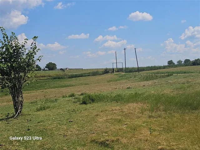 a view of a lake with a big yard