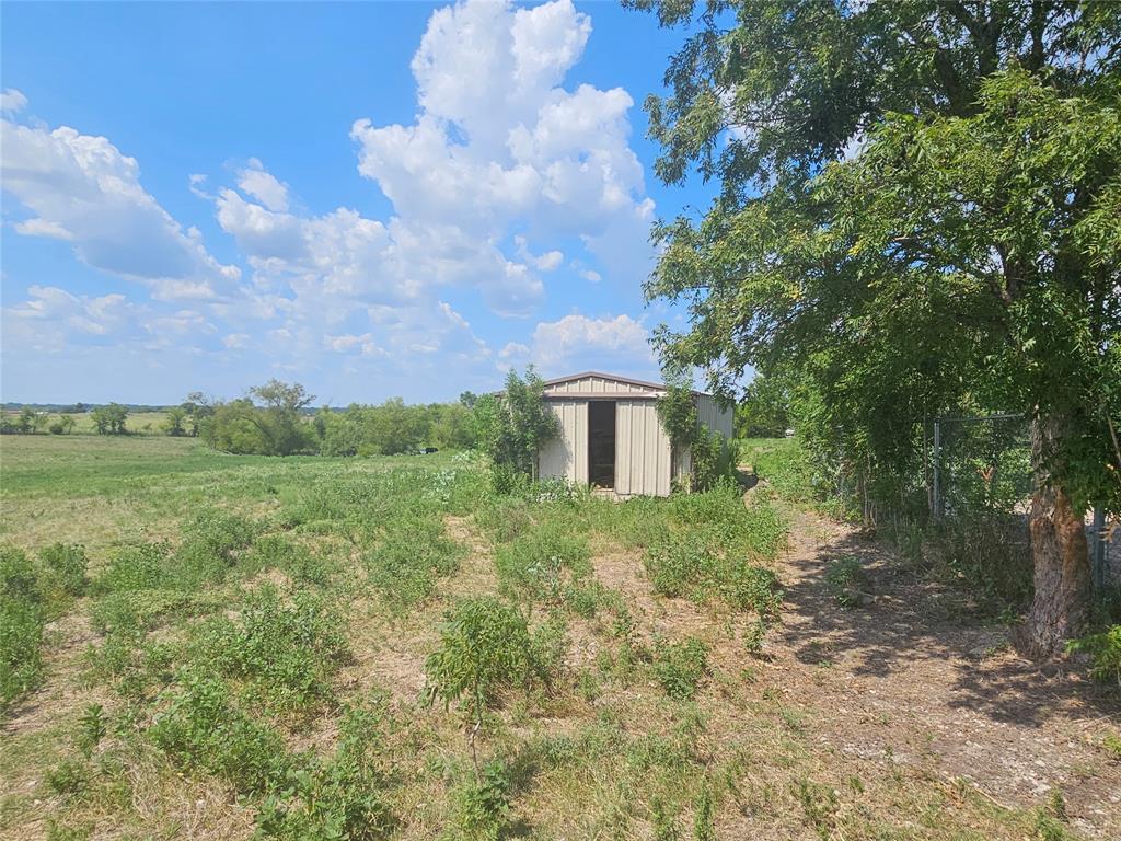 810 Cody Road Ennis, TX 75119 - Photo 10 of 31 a view of a green field