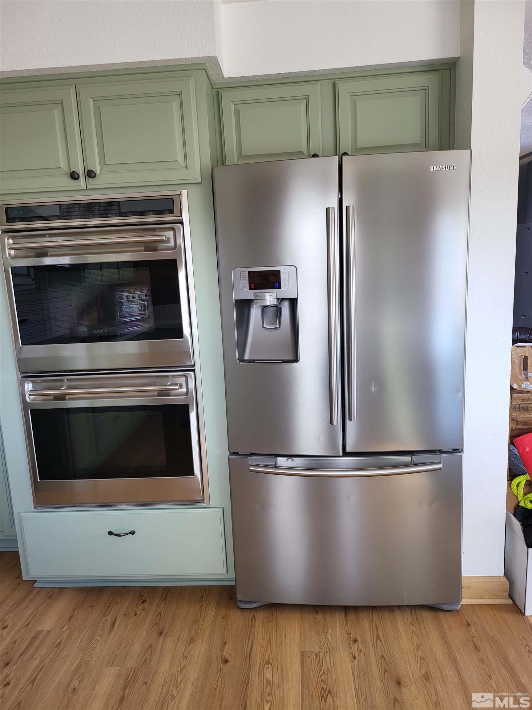 2700 Wilcox Ranch Road Reno, NV 89510 - Photo 12 of 33 a metallic refrigerator freezer sitting in a kitchen