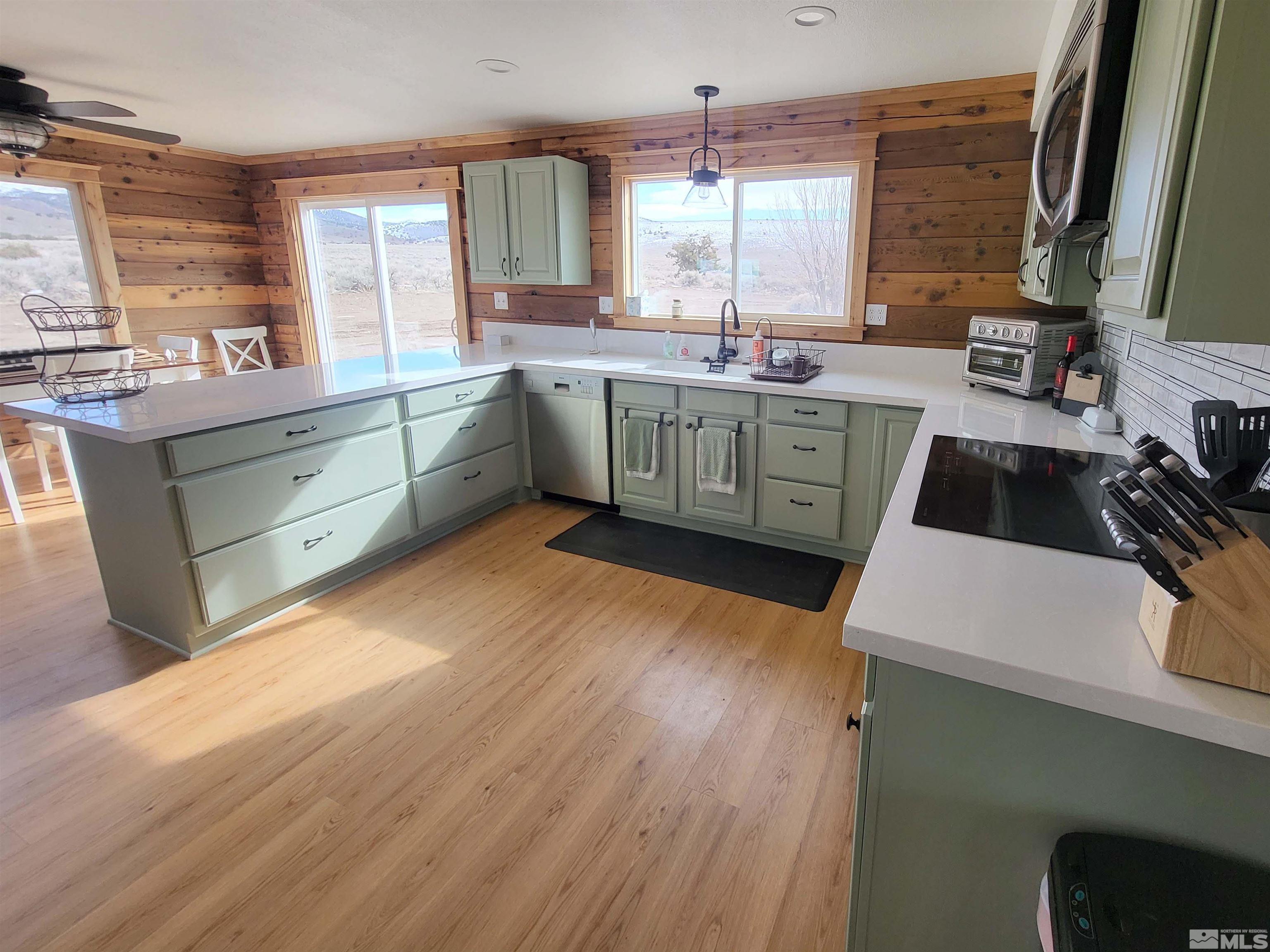 2700 Wilcox Ranch Road Reno, NV 89510 - Photo 16 of 33 a kitchen with a sink a window and cabinets