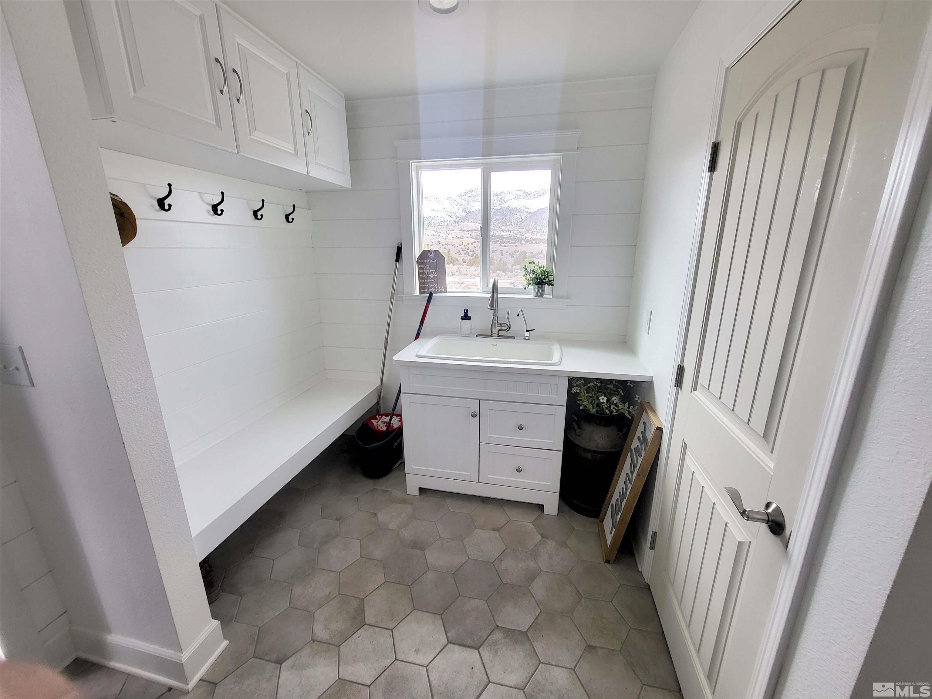 2700 Wilcox Ranch Road Reno, NV 89510 - Photo 19 of 33 a utility room with cabinets washer and dryer