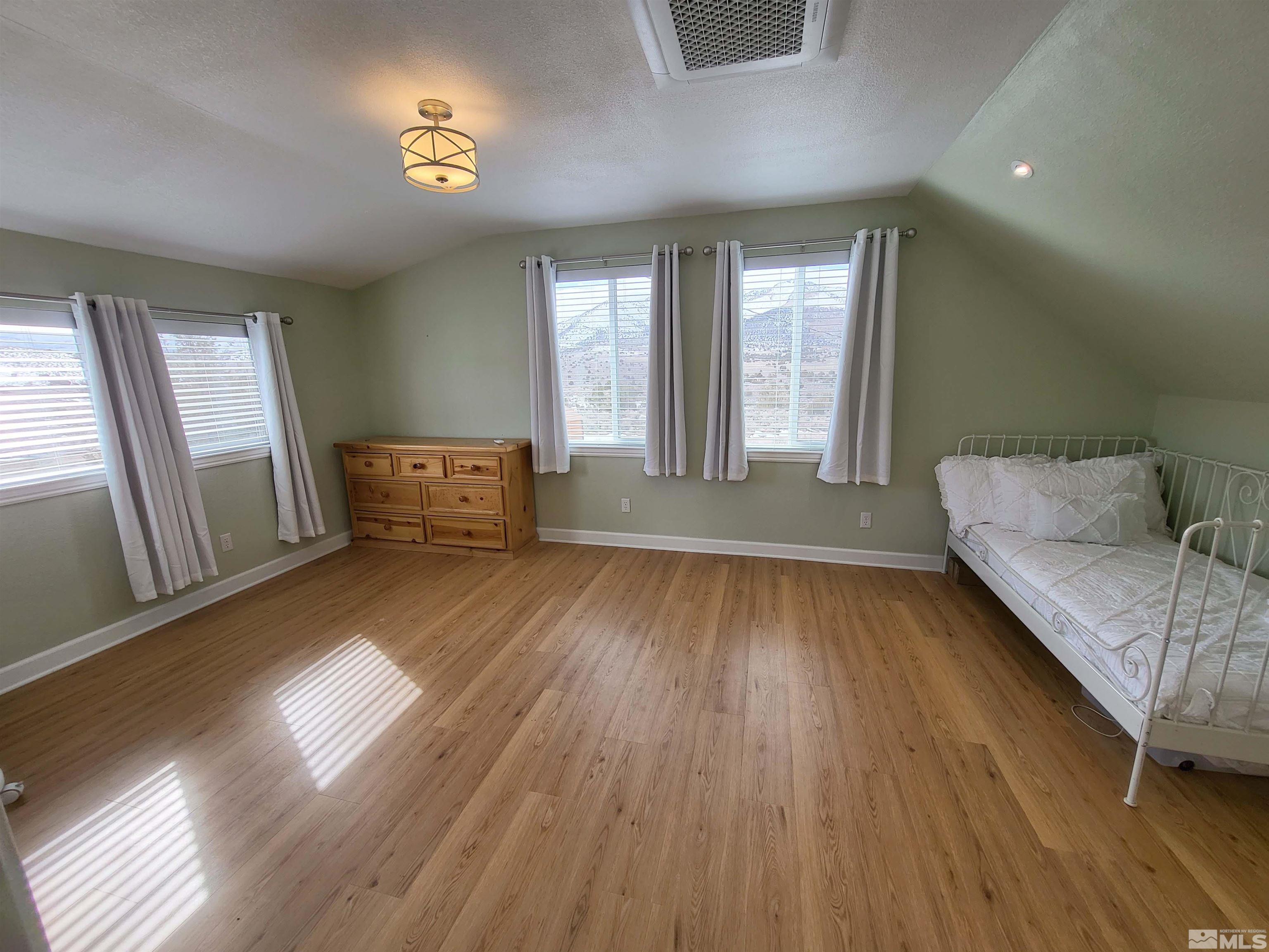 2700 Wilcox Ranch Road Reno, NV 89510 - Photo 24 of 33 a living room with furniture and a wooden floor